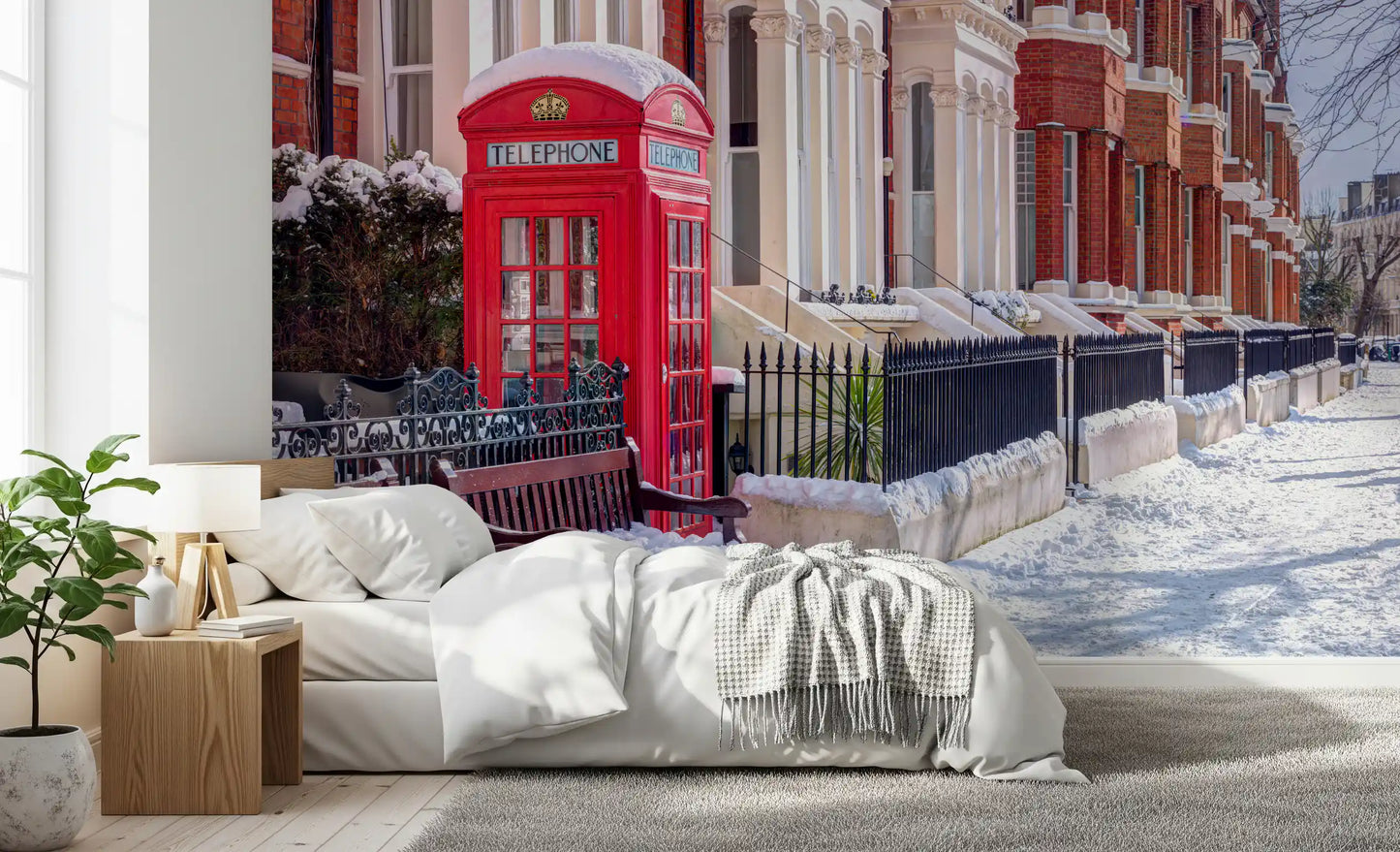Red telephone booth wall mural against snow-covered brick buildings in bedroom., GD10423