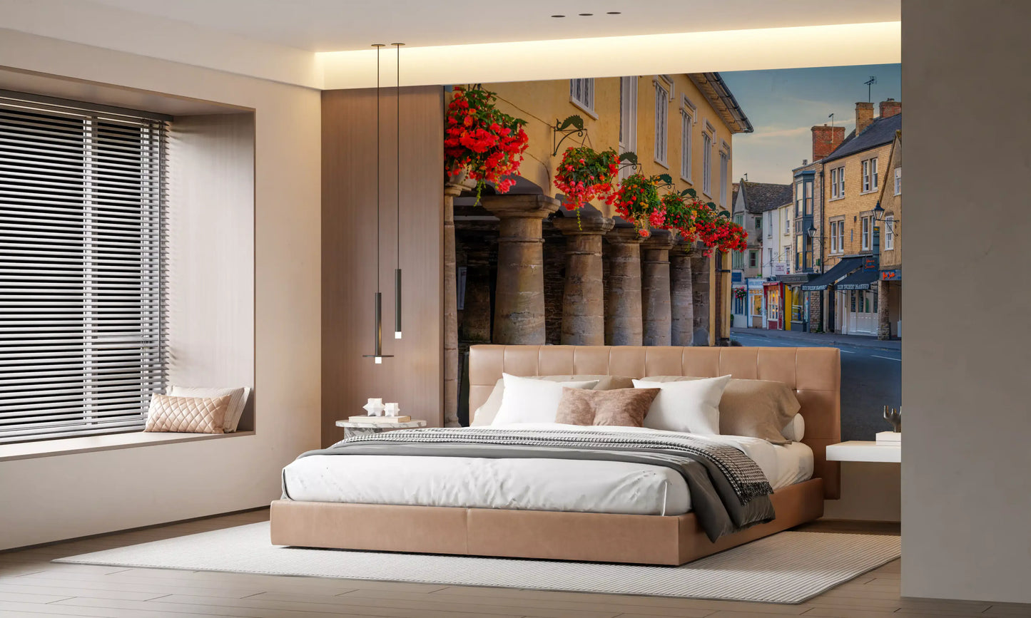 Honey-coloured limestone buildings along a quiet village street mural., GD10427
