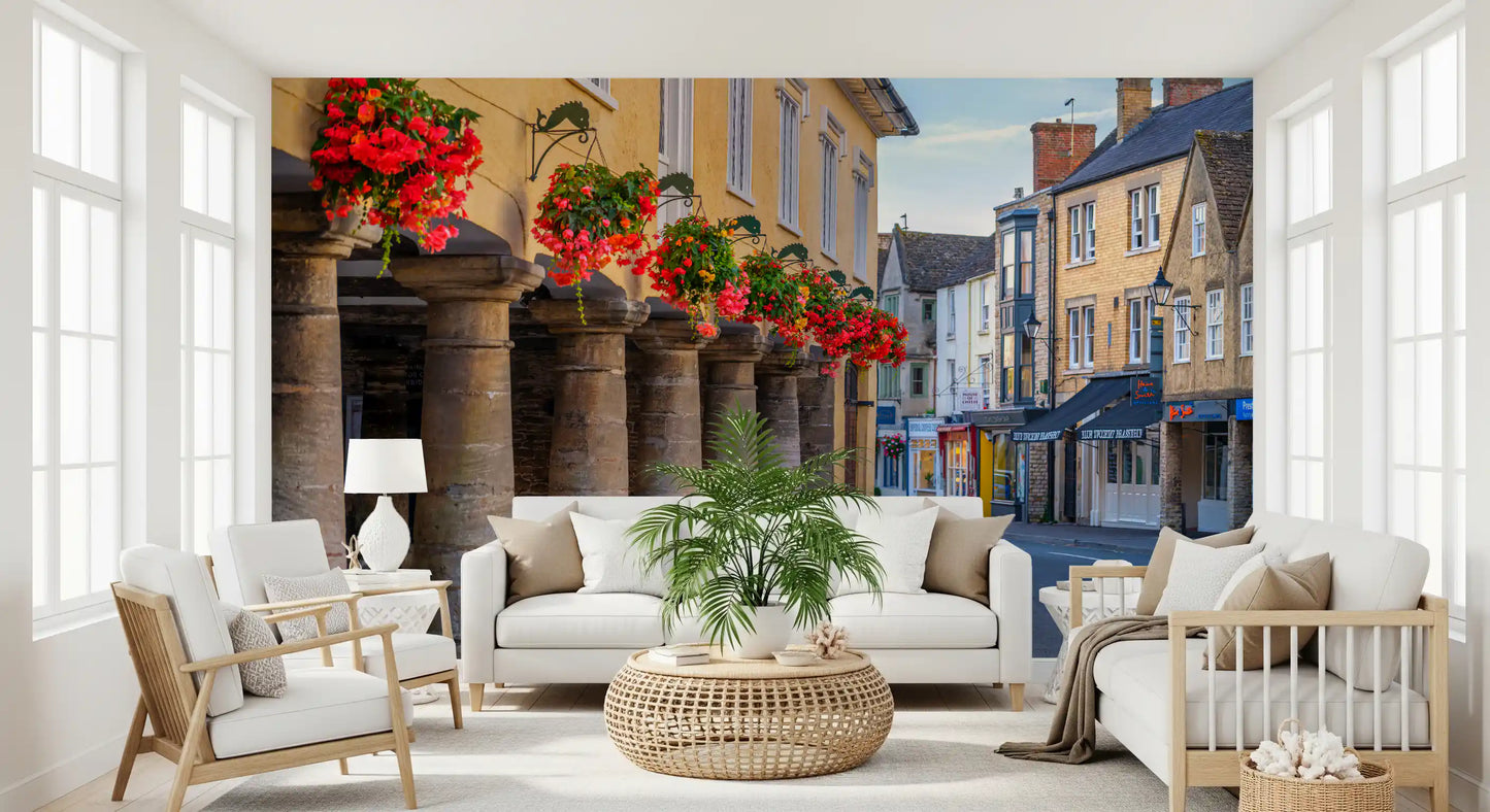Village wall mural with Cascading red and pink blooms above stone archway., GD10427