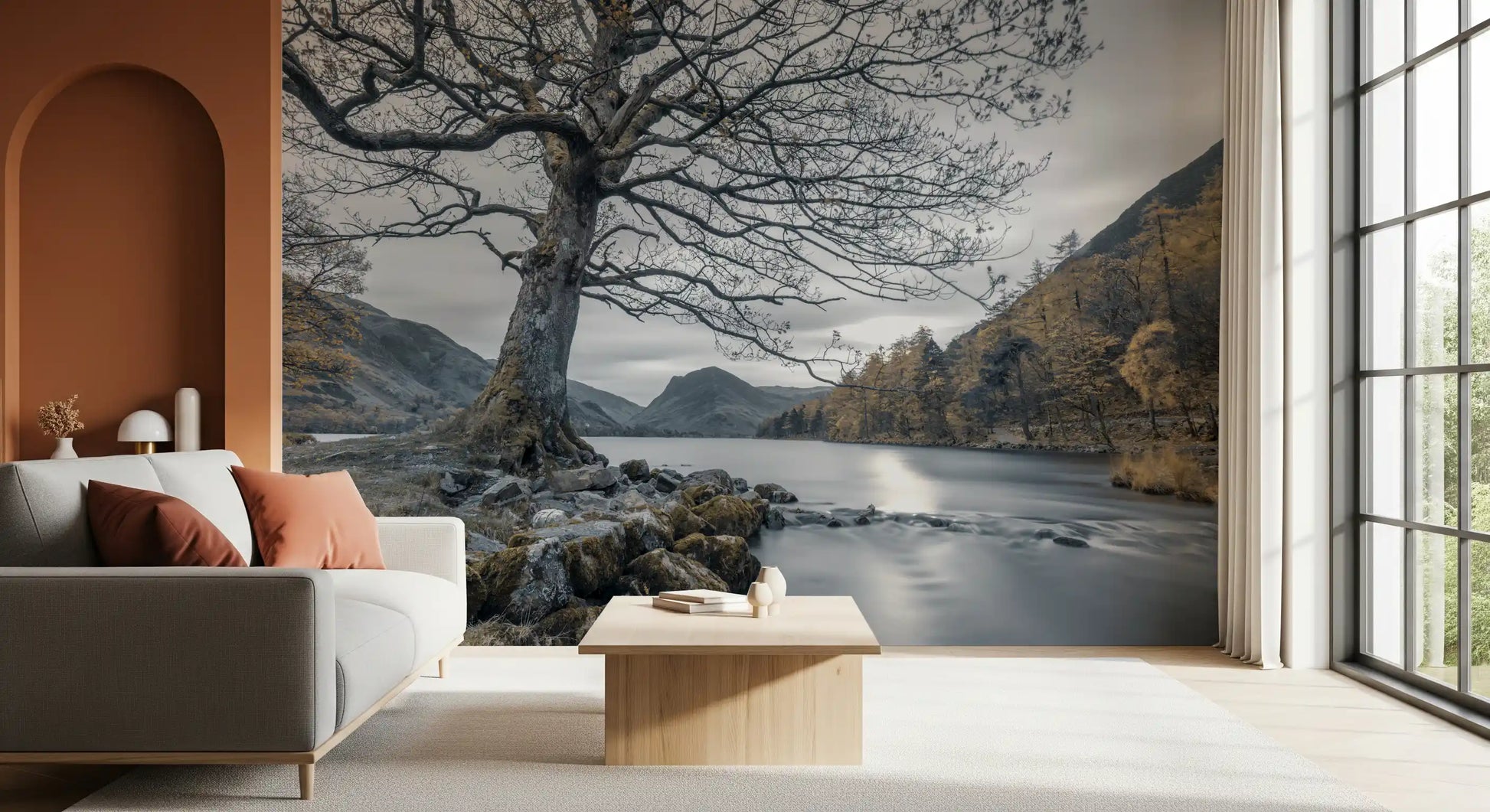 Wall mural with Slate grey lake surface reflecting soft light below bare oak branches., GD10431