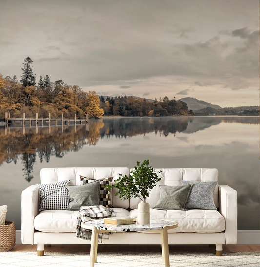 Reflective lake wall mural displayed in a living room with autumn trees.