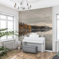 Autumn shore wall mural with Wooden dock posts extending into still grey lake water., GD10432