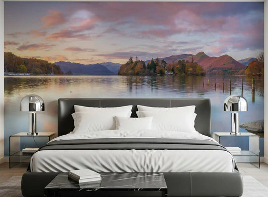 Lake and mountain mural adding depth to a bedroom accent wall.