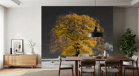 Lone tree with golden leaves against a monochrome grey backdrop mural in dining area., GD10438