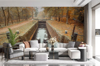 Ember Leaves wall mural with Golden and orange foliage along canal in living area., GD10443