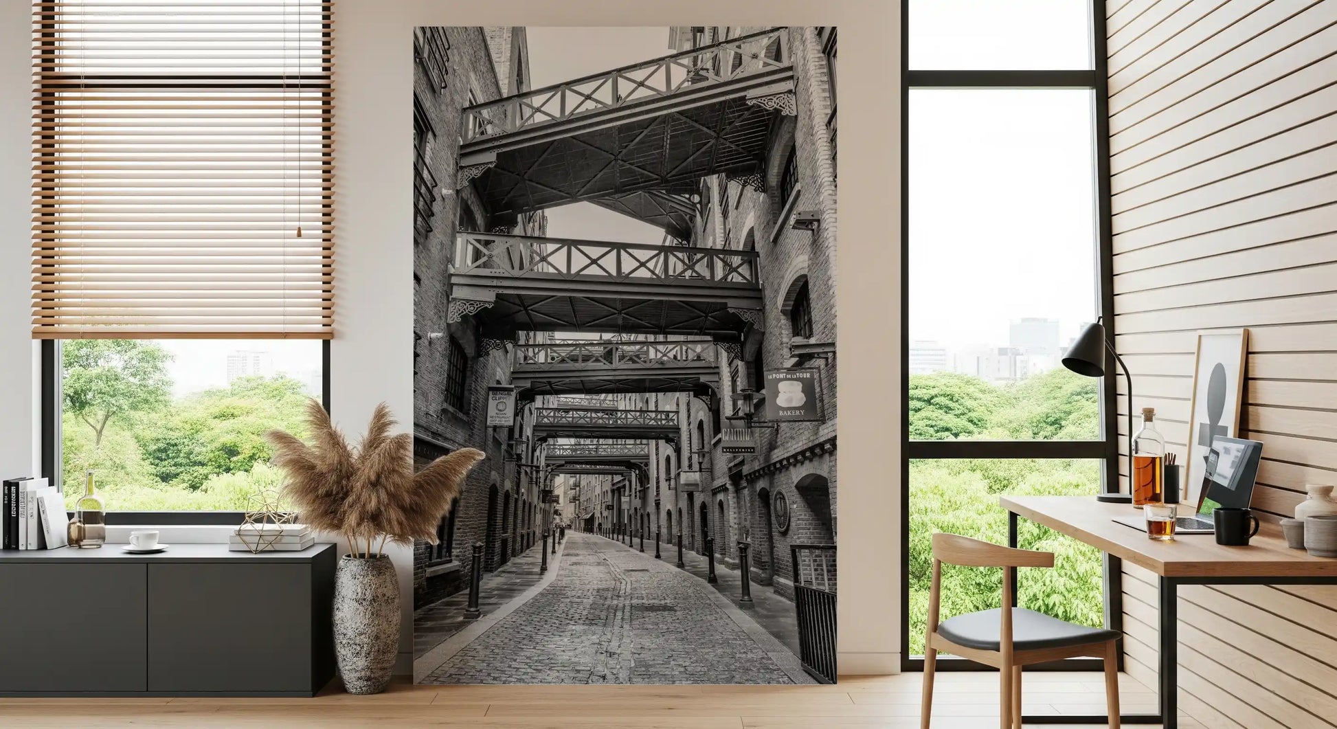 Dark metal bollards along the cobblestone lane in this wall mural., GD10447