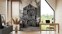 Black and white typographic wall mural featuring stacked letterforms., GD10449
