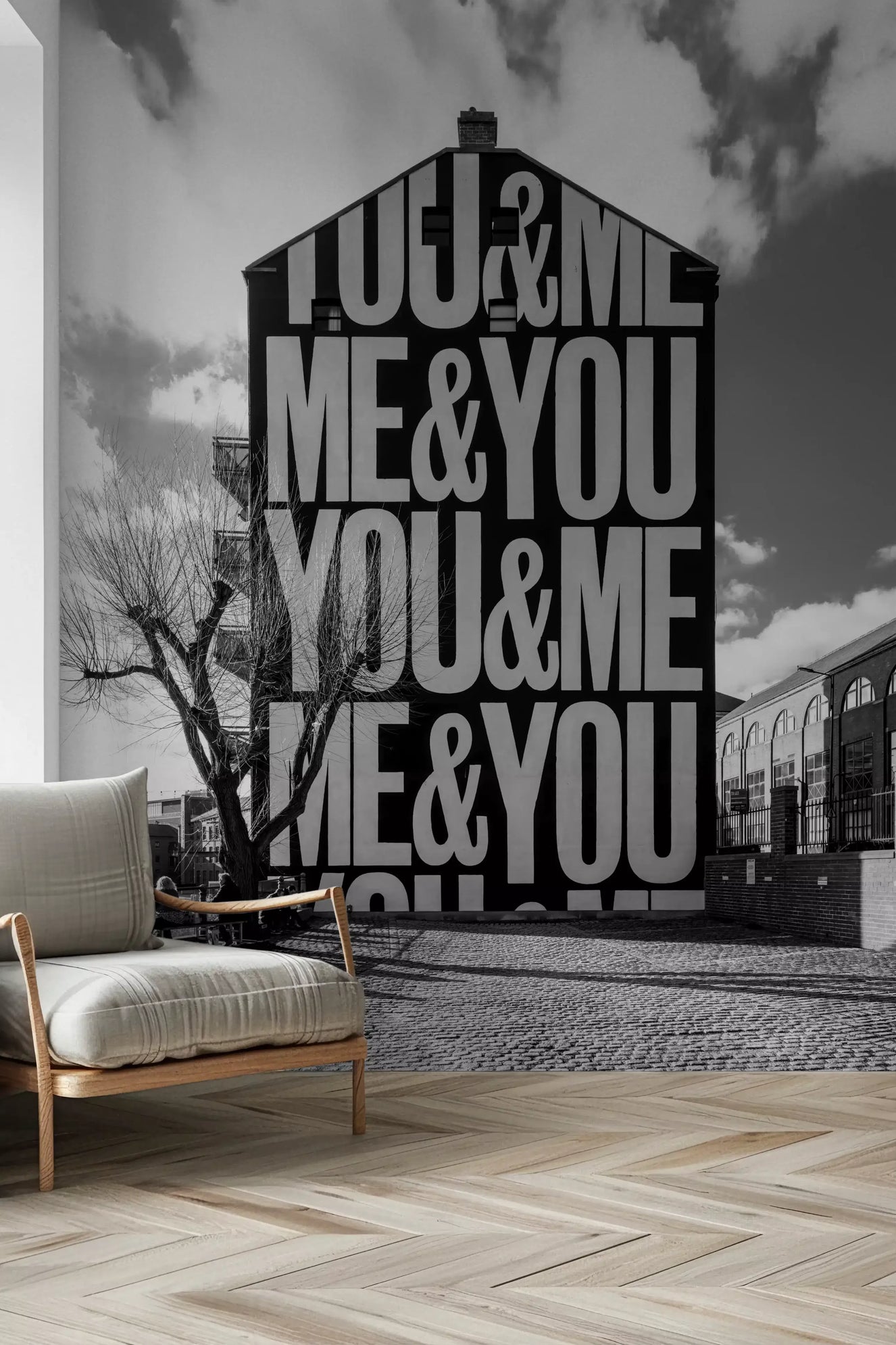 Urban typographic wall mural displayed in a hallway space with gray tone.