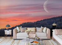 Dusk landscape wall mural with crescent moon in a living room space.