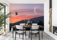 Twilight forest wall mural with crescent moon and pink dusk sky.