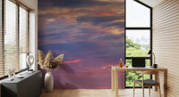 Scattered cream and peach lit clouds across purple dusk sky wall mural., GD10453