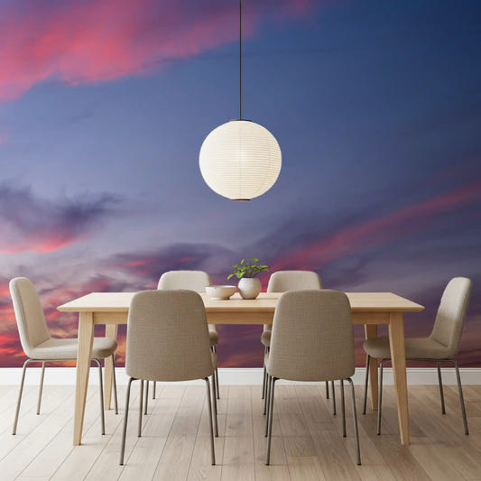 Pink and blue dusk cloud wall mural displayed in a dining room space.