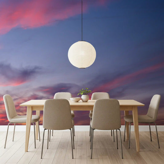 Pink and blue dusk cloud wall mural displayed in a dining room space.