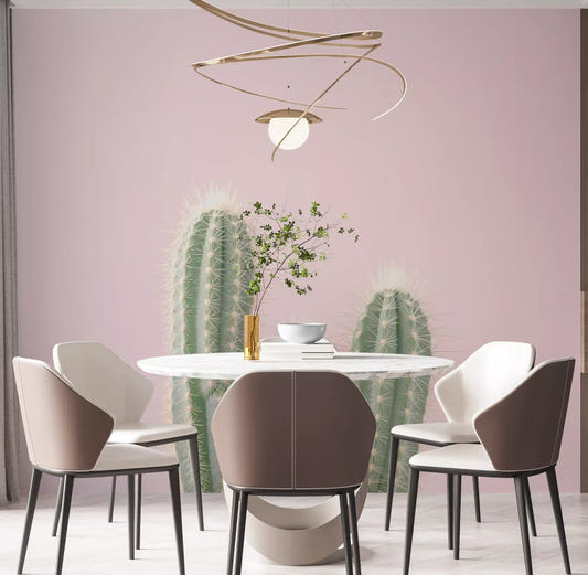 Cactus wall mural with blush-pink background featured in a dining room space.
