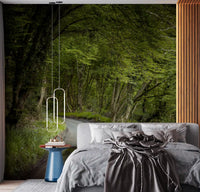 Enchanted forest pathway wall mural displayed in a bedroom setting.