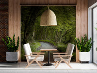 Forest pathway wall mural with Wet road with puddle reflecting greenery