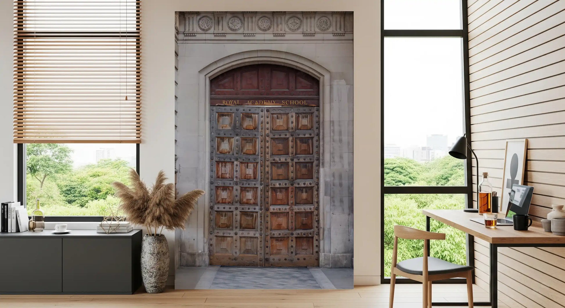 Carved grey stone archway framing wooden doors in historic portal wall mural., GD10463