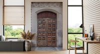 Carved grey stone archway framing wooden doors in historic portal wall mural., GD10463