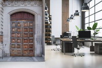 Academy portal mural with Iron-riveted square wood panels on massive doors in office., GD10463