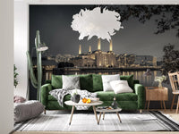Dark grey cityscape wall mural with overhanging tree branches and chimneys., GD10468