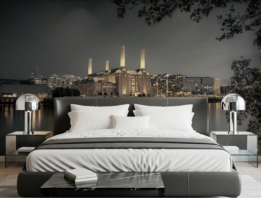 Bedroom wall mural showing four glowing chimneys above a waterfront skyline.