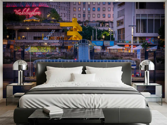 City riverside wall mural featured in a bedroom with neon colors.