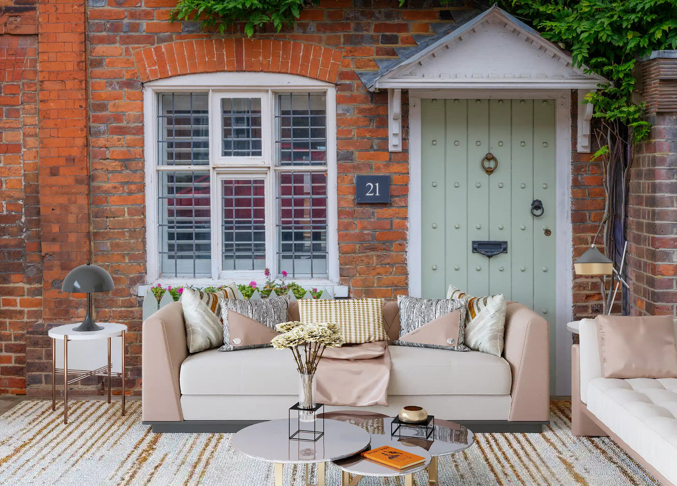 Cottage brick facade wall mural adding warmth to a living room.