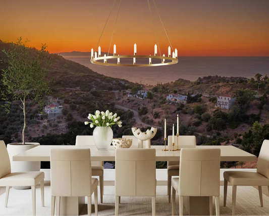 Golden hour coastline serenity wall mural as a feature in a dining room space.