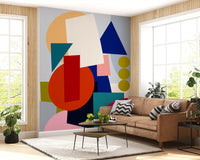 Abstract shape wall mural featuring magenta oval and peach accents in living area., GD10551