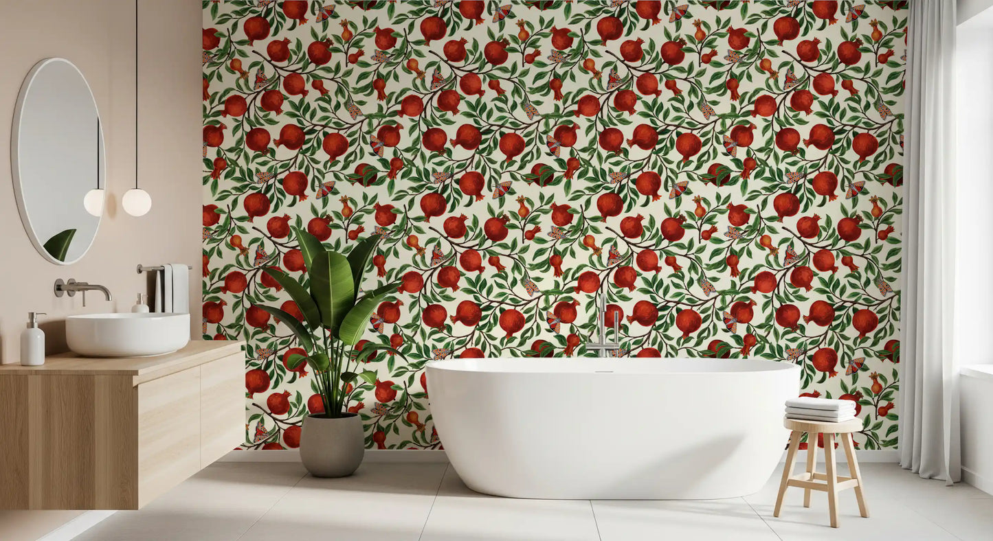 Bathroom wallpaper with red pomegranates and green foliage on cream background.