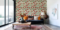 Botanical pomegranate wallpaper with layered green leaves and brown branches.