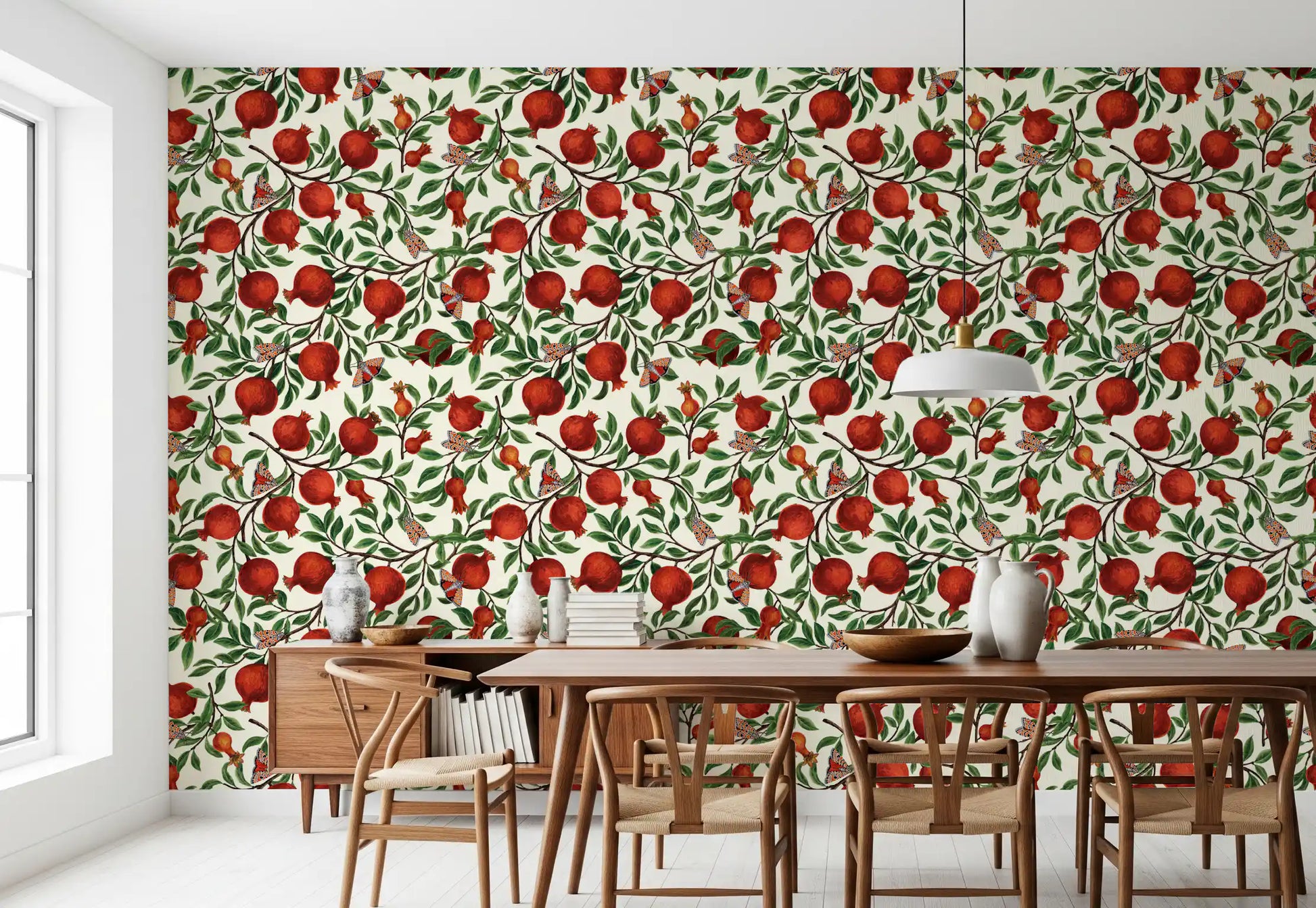 Red pomegranate wallpaper with ripe fruits on brown branches and green leaves.