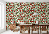 Red pomegranate wallpaper with ripe fruits on brown branches and green leaves.