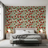Green leaf and red pomegranate wallpaper with orange-winged butterflies in bedroom.