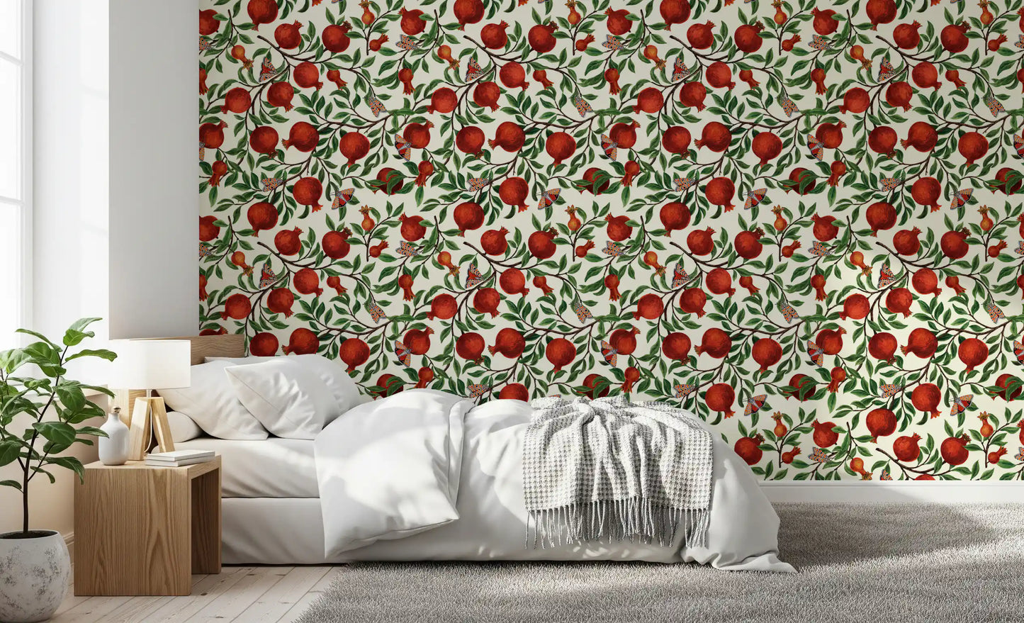 Fruit and butterfly repeat pattern wallpaper on soft cream backdrop in bedroom.