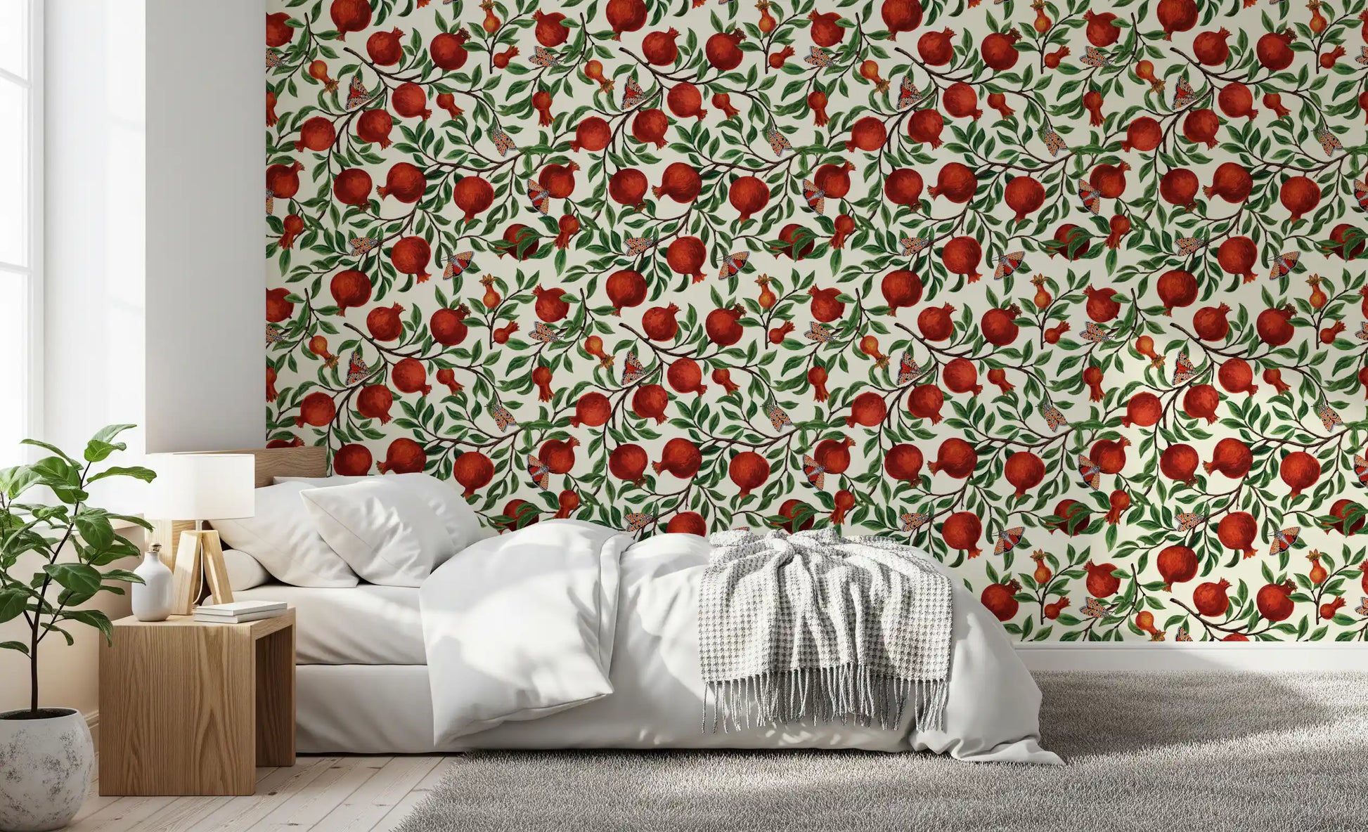 Fruit and butterfly repeat pattern wallpaper on soft cream backdrop in bedroom.