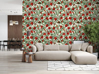 Green leaf and red pomegranate wallpaper with dark brown curving branches.
