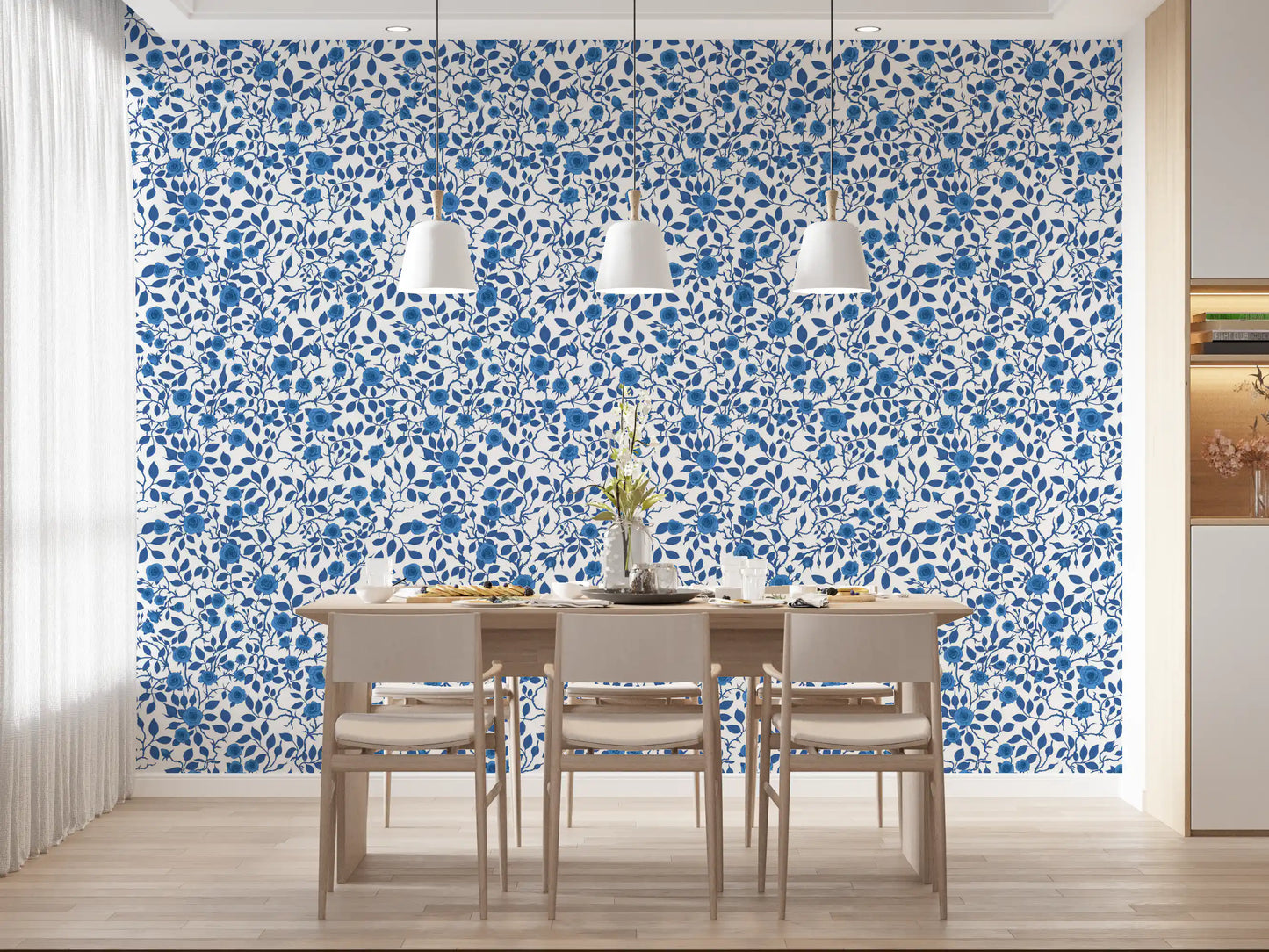 Cobalt blue rose wallpaper with layered leaves and curving stems in dining room.