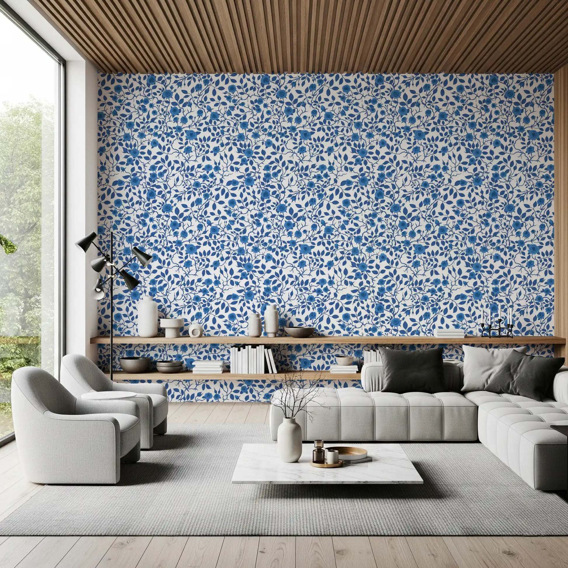 Wallpaper showing blue rose and thorny vine pattern on white