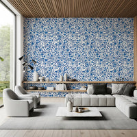 Wallpaper showing blue rose and thorny vine pattern on white