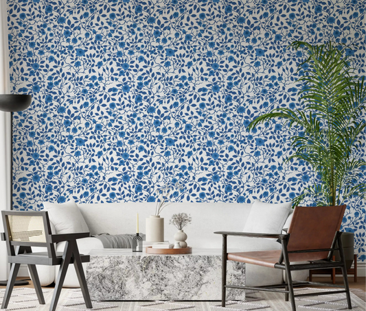 Living room wallpaper with monochrome blue rose floral repeat.