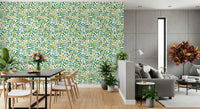 Yellow and green wallpaper with trailing rose vine repeat on white base.