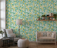 Yellow floral vine wallpaper with open blooms and tight rose buds in nursery.