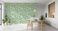 Rose trellis wallpaper with green thorny branches and yellow buds.