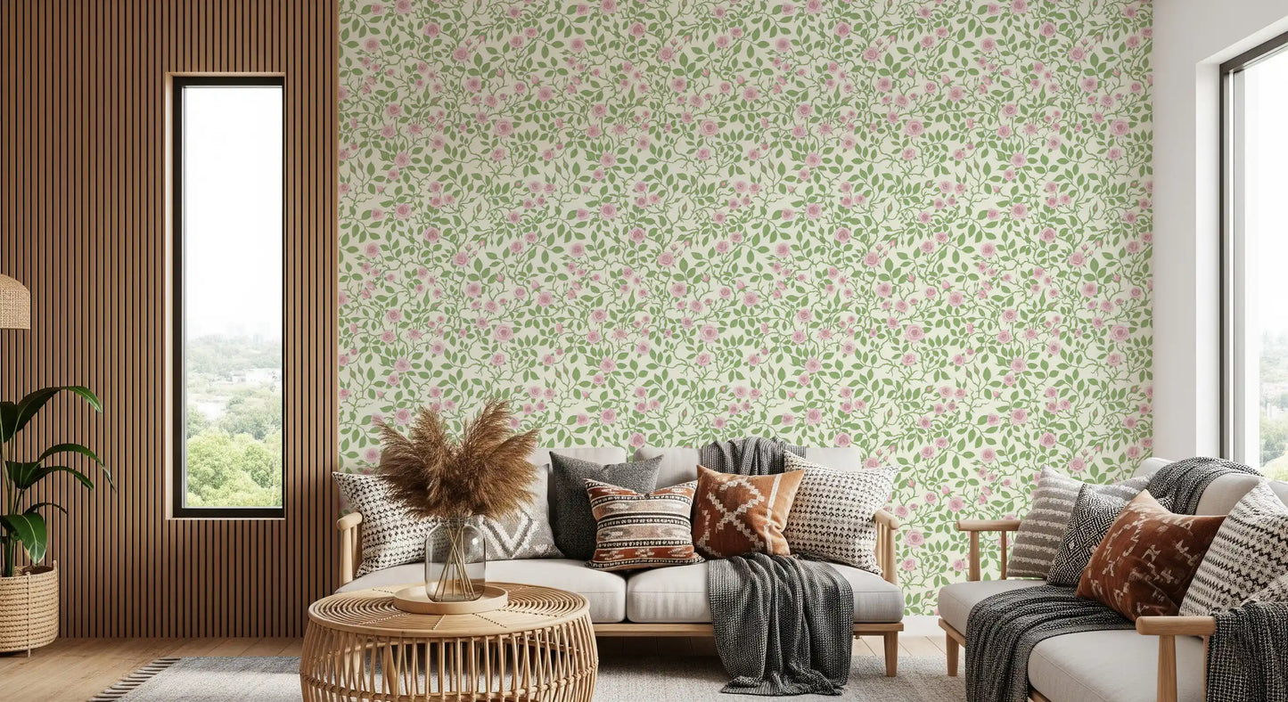 Rose vine wallpaper with green thorny stems and pink buds on cream backdrop.