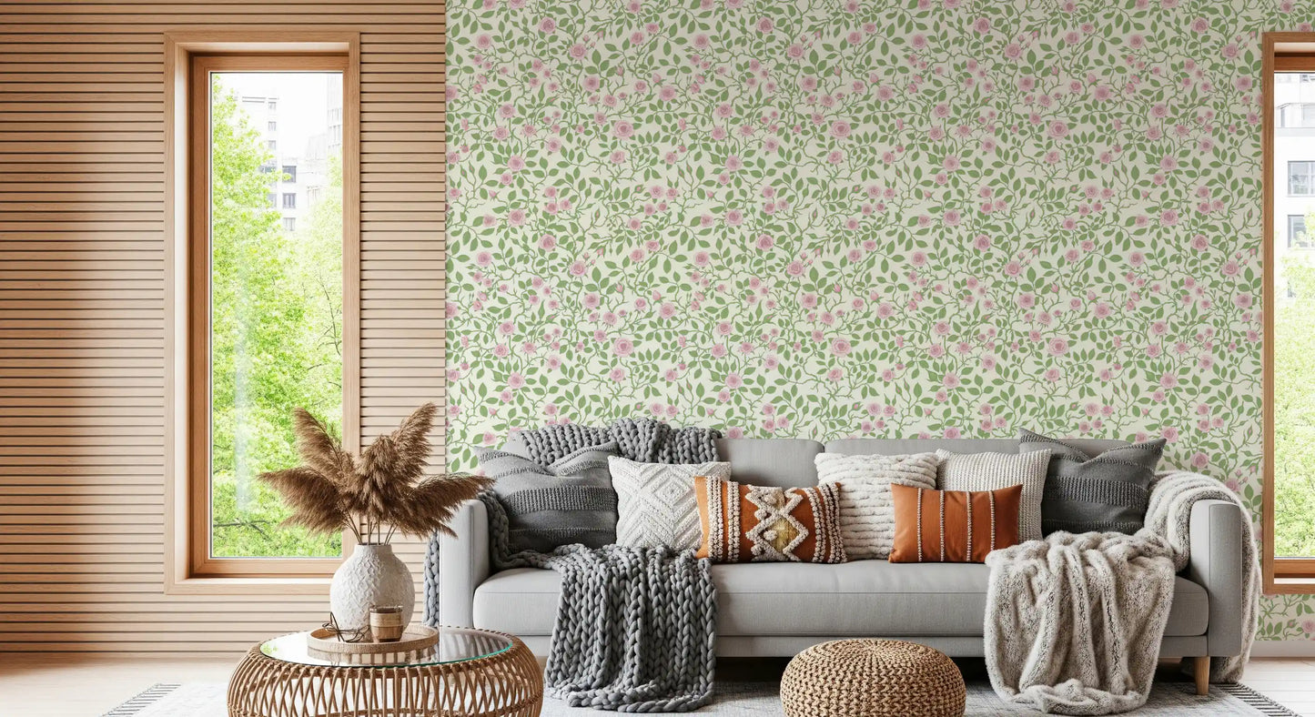 Pastel rose wallpaper with muted green foliage and trailing vine branches.