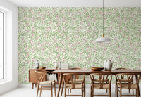 Cream background wallpaper with soft pink roses and curving green branches in dining room.