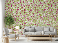 Magenta and green wallpaper with trailing rose vine repeat on cream base.