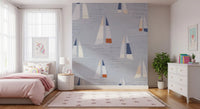 Bedroom sailboat wall mural with coastal blue tones and nautical motifs.