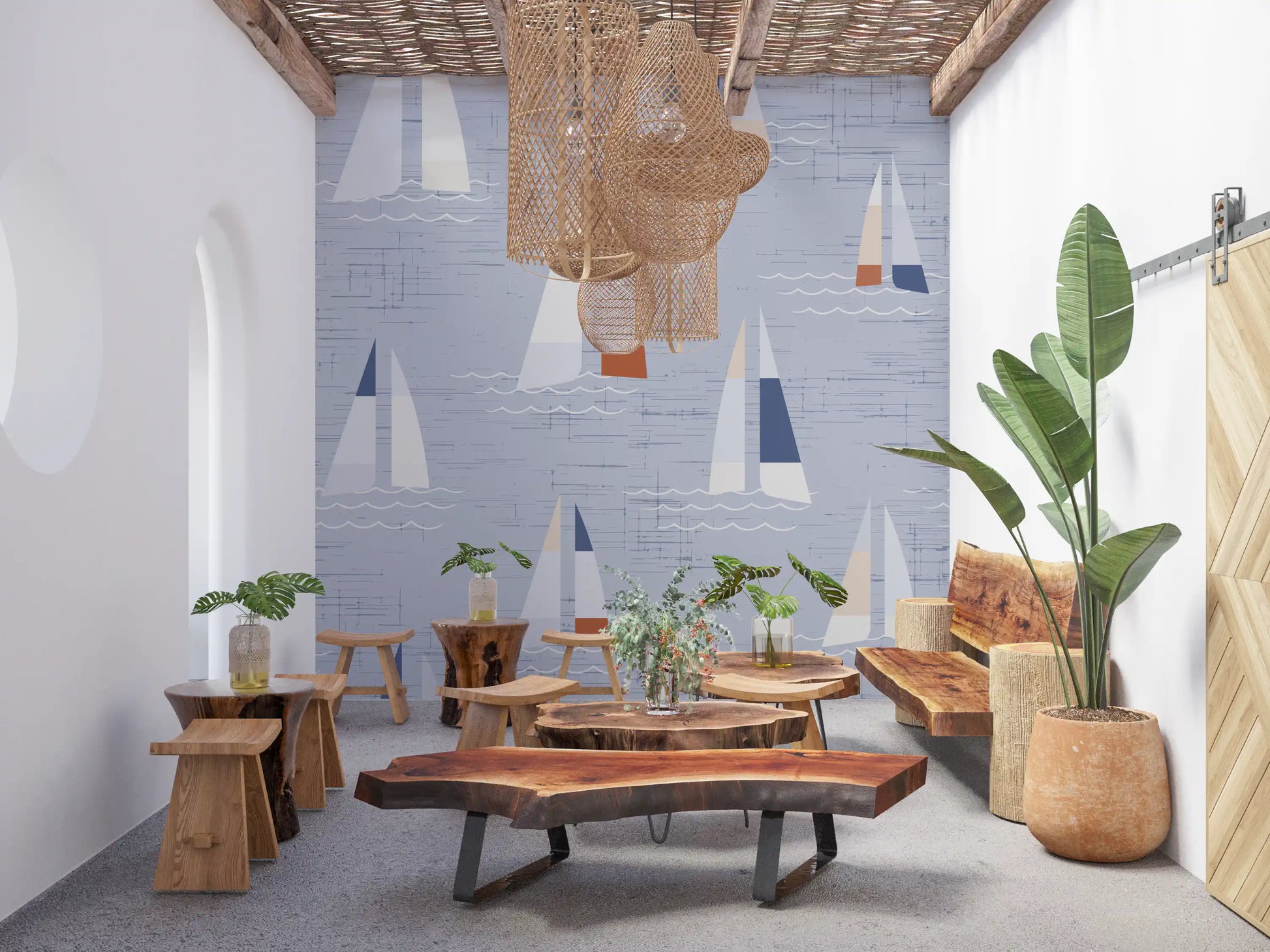 Coastal blue wall mural with scattered sailboat motifs and wave lines.